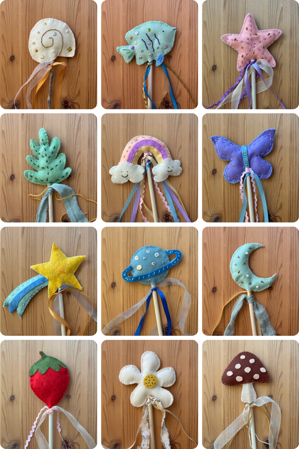 Collection of colorful felt wand toys on a wooden surface
