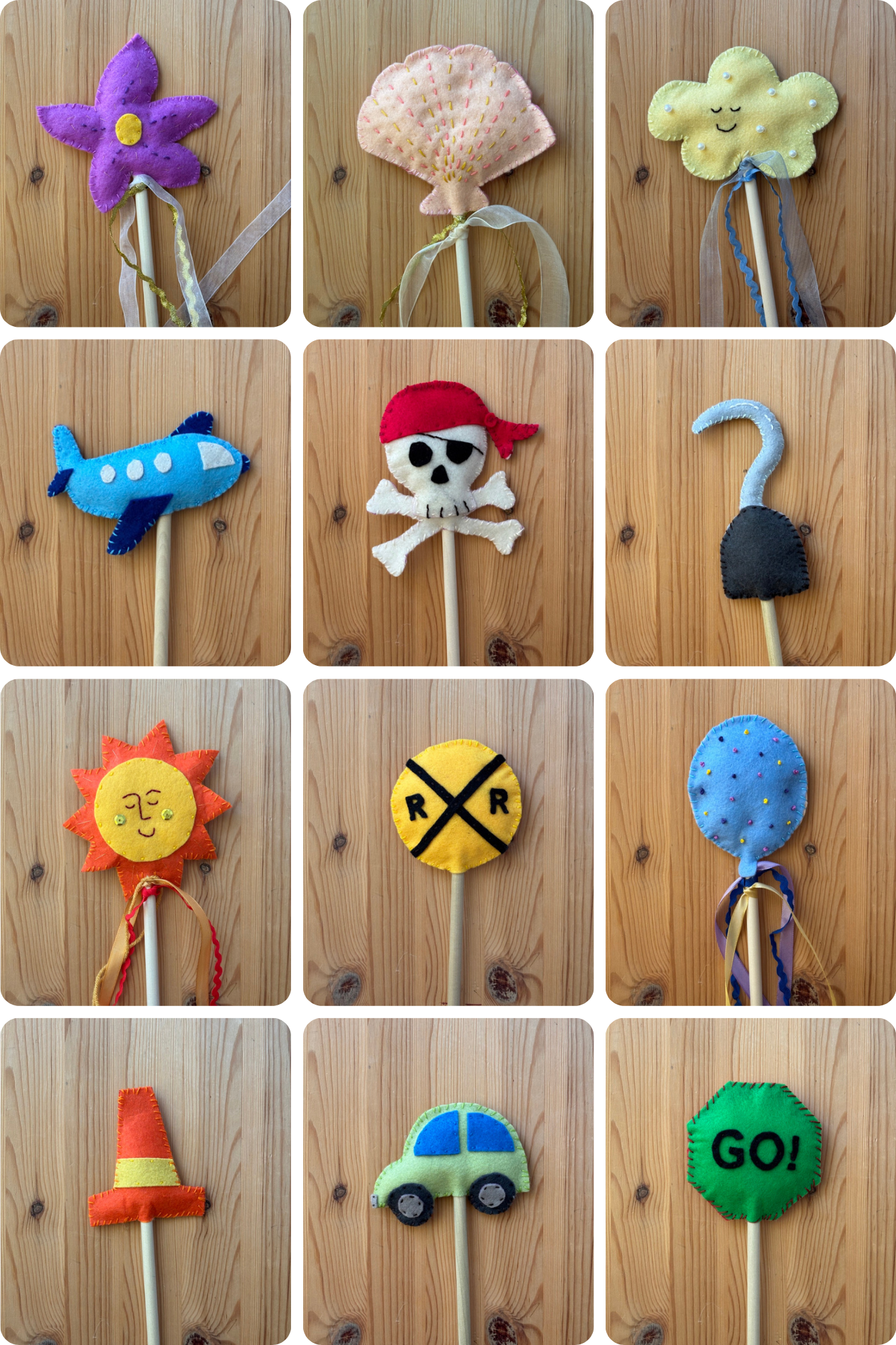 Collection of colorful felt wand toys on a wooden background
